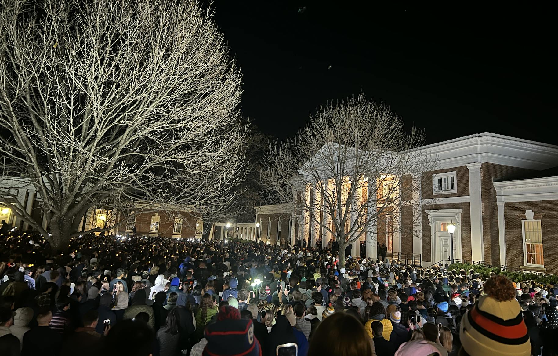 Attendees wore orange ribbons and carried candles.&nbsp;