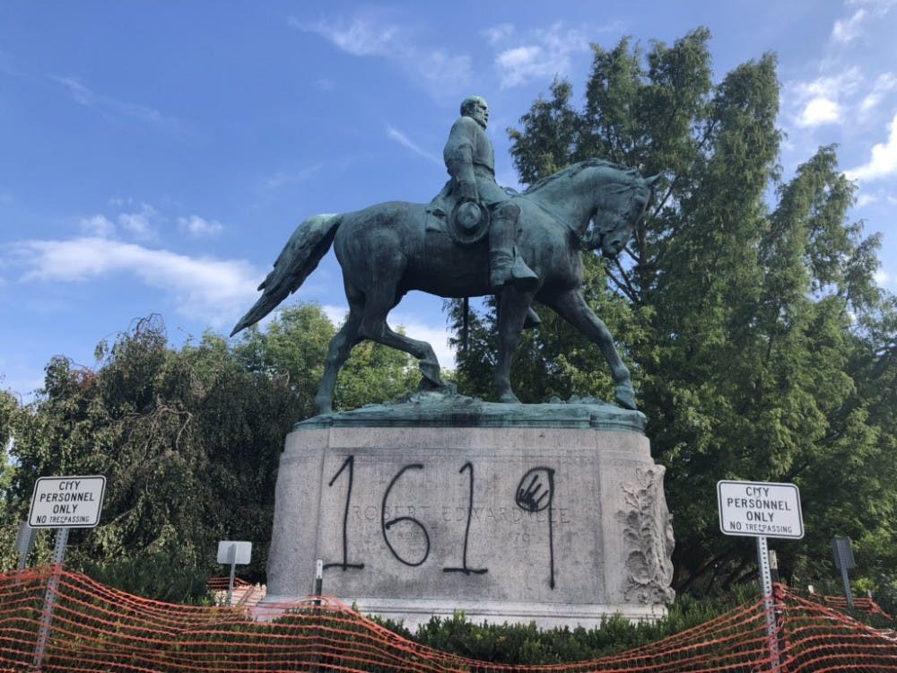 The spray painted "1619" references the year enslaved Africans were first brought to North America