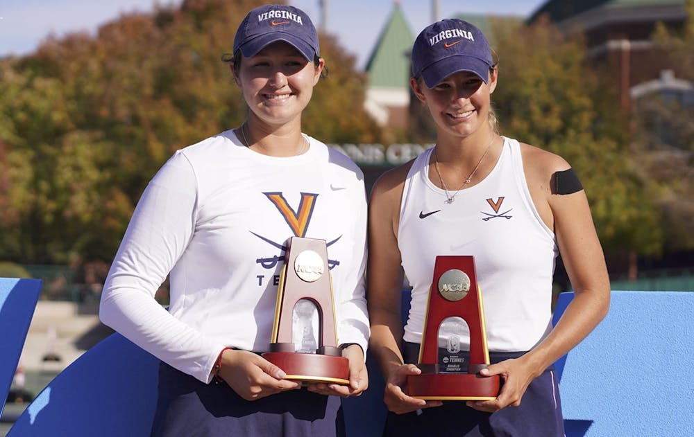 Senior Elaine Chervinsky and senior Melodie Collard pose after winning the women's doubles title.