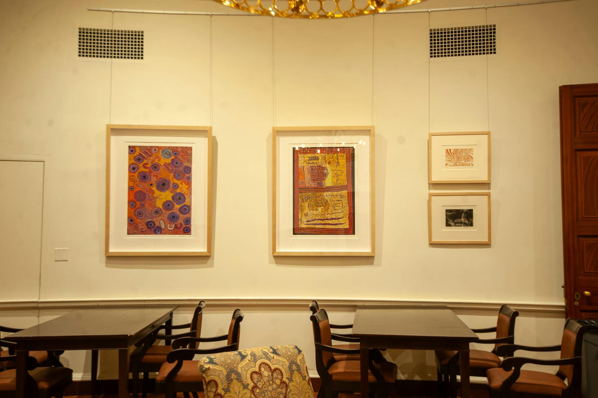 Most of the prints in the exhibition have a similar style, with vivid points of color combining and layering to create circles, planes and arc-like shapes. 