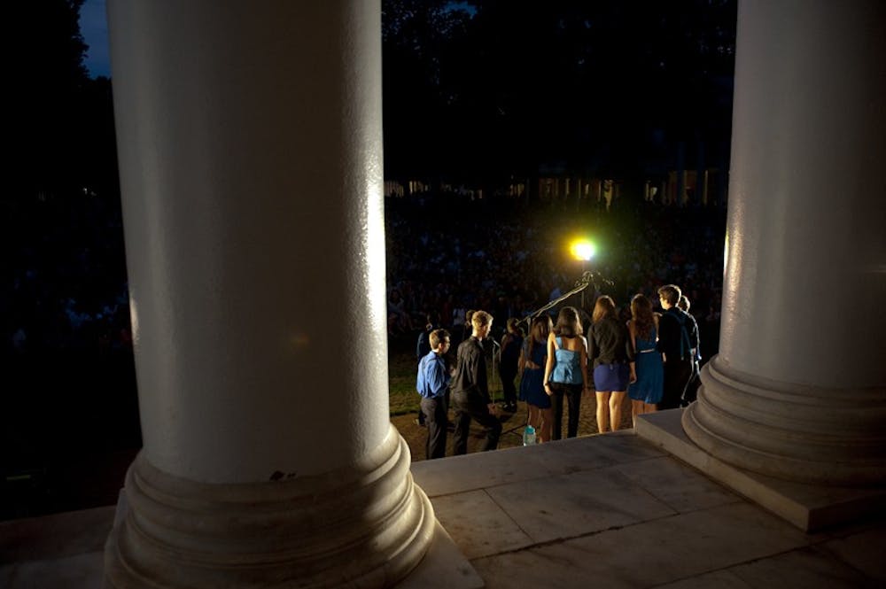 	<p>University community members stood on the Lawn&#8217;s newly laid grass Wednesday evening to take in the annual end-of-summer tradition</p>