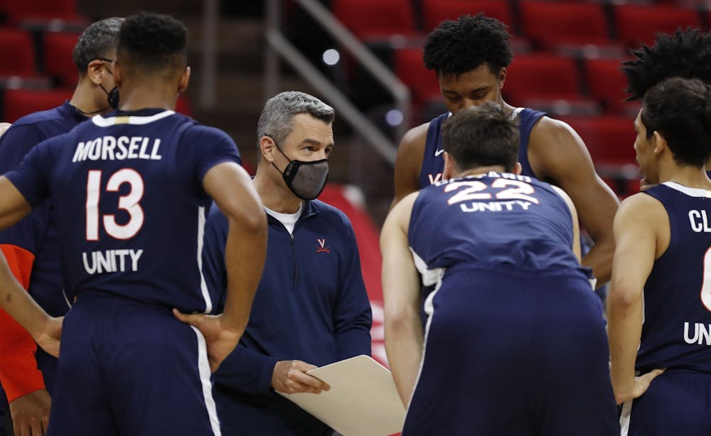Virginia Coach Tony Bennett talks to his players during the first half of the game Wednesday night.