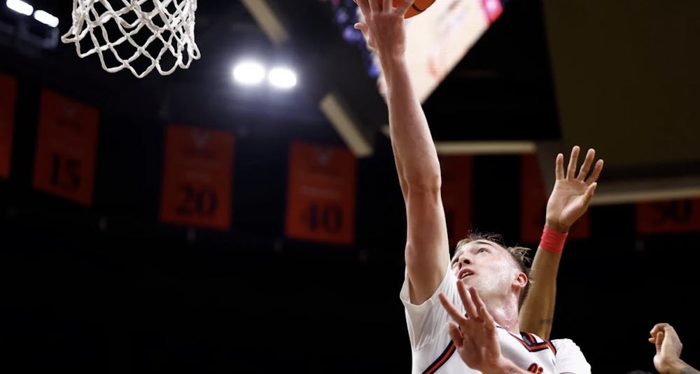 <p>Andrew Rohde reaches for a layup.</p>