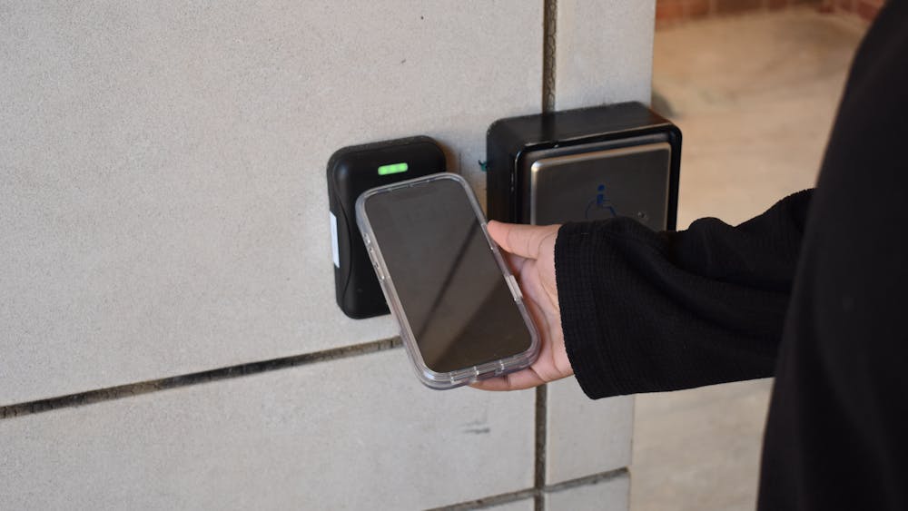 A student uses the new U.Va. digital ID embedded into Apple Wallet to authenticate into a building Nov. 11, 2025.