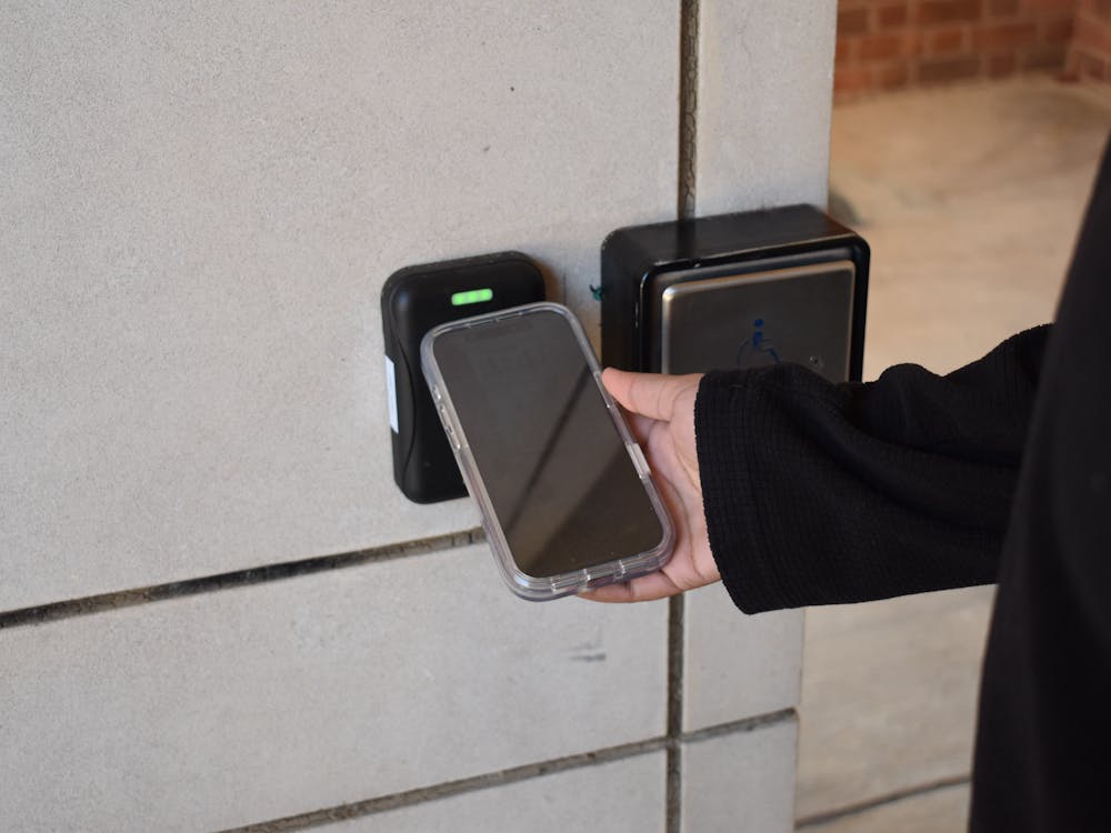 A student uses the new U.Va. digital ID embedded into Apple Wallet to authenticate into a building Nov. 11, 2025.