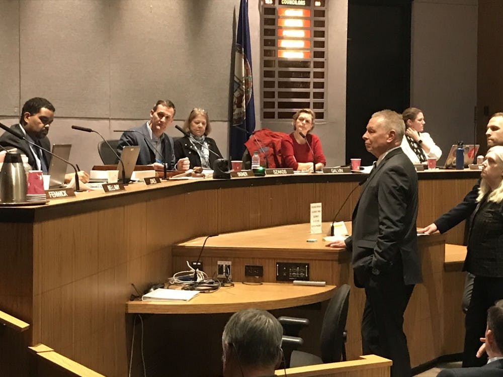 City Attorney Craig Brown takes questions from Council about the permitting regulations.