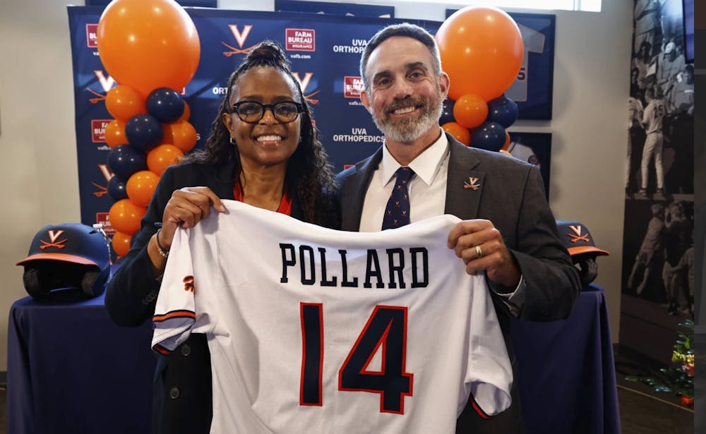 <p>Carla Williams and Chris Pollard pose at his introductory press conference.</p>