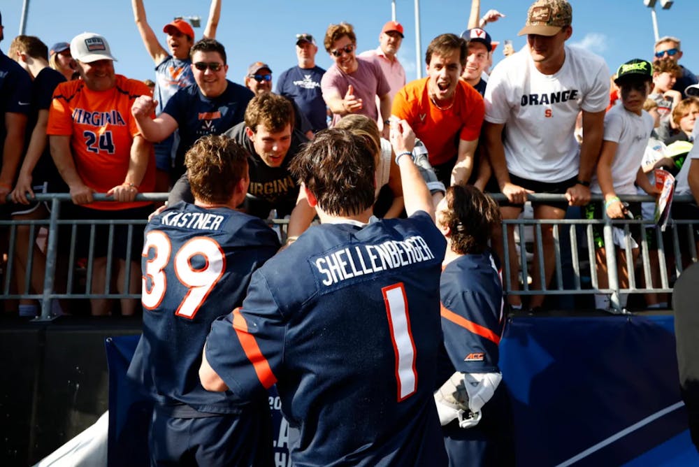 <p>Shellenberger reaches into the stands after the game.</p>