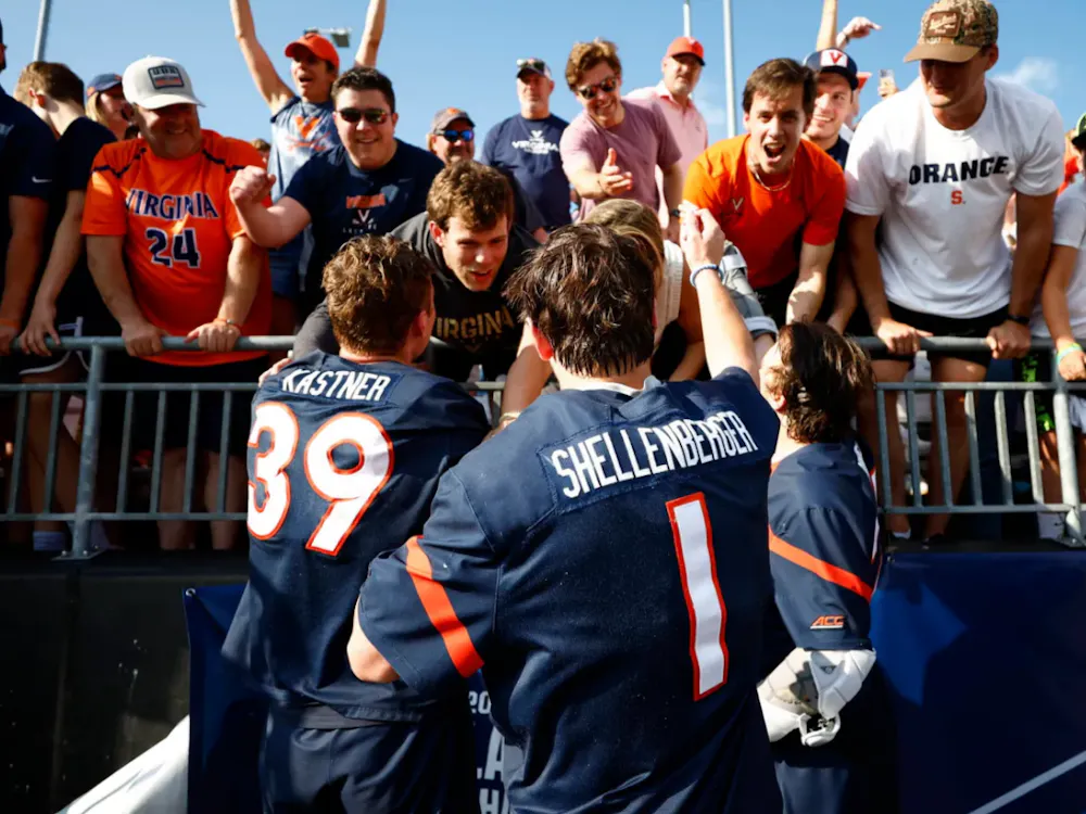 Shellenberger reaches into the stands after the game.