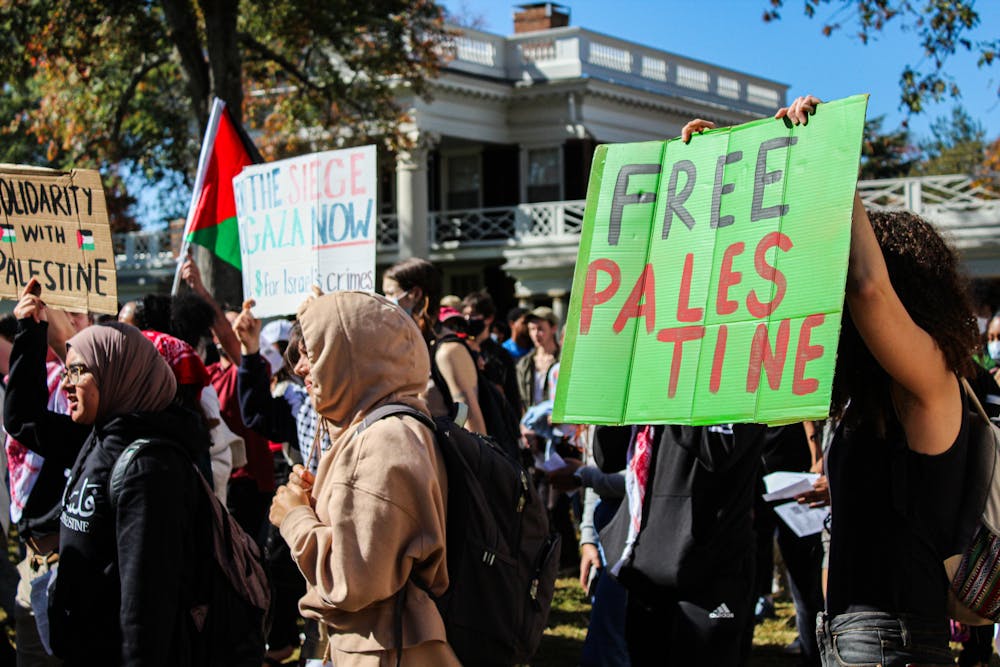 The group held protest signs, chanted and wore the colors of the Palestinian flag.