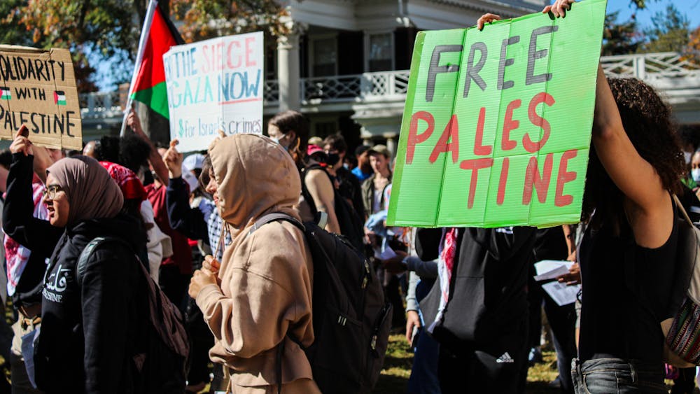 The group held protest signs, chanted and wore the colors of the Palestinian flag.