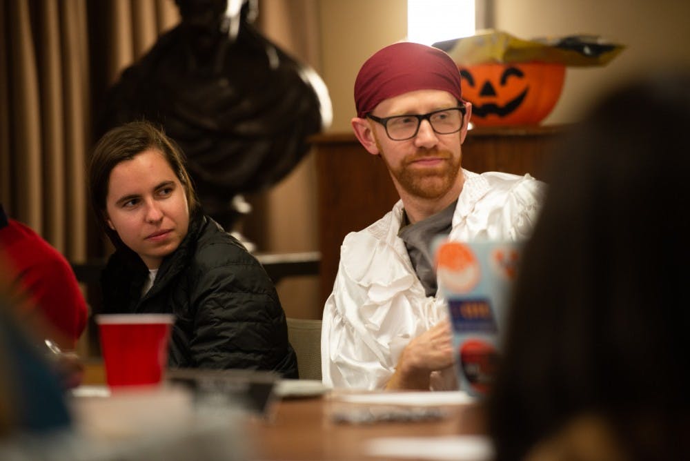 <p>"Any bylaws changes we make have to be approved by the [University] General counsel’s office,” Honor Chair and Medical Student Ory Streeter (right) said. (Some members of the Honor Committee wore Halloween costumes at Sunday's meeting). &nbsp;</p>