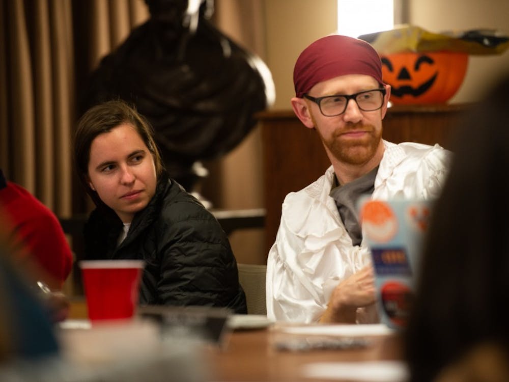 "Any bylaws changes we make have to be approved by the [University] General counsel’s office,” Honor Chair and Medical Student Ory Streeter (right) said. (Some members of the Honor Committee wore Halloween costumes at Sunday's meeting). &nbsp;