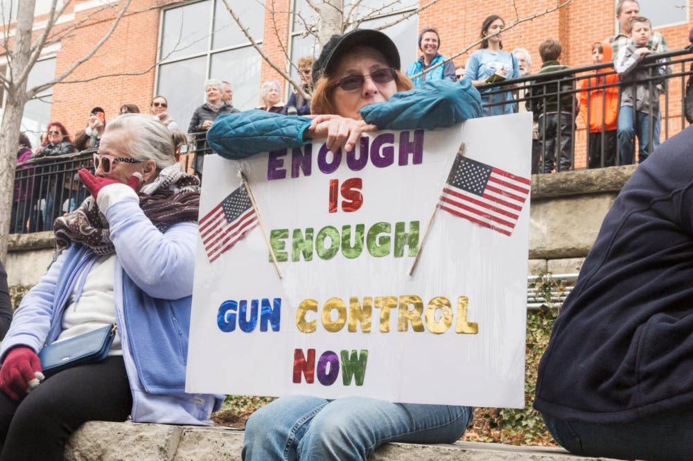 More than a thousand people of all ages gathered at the Sprint Pavilion in Charlottesville before the march around the Downtown Mall, many holding signs against gun violence.