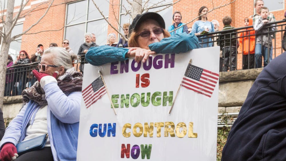 More than a thousand people of all ages gathered at the Sprint Pavilion in Charlottesville before the march around the Downtown Mall, many holding signs against gun violence.