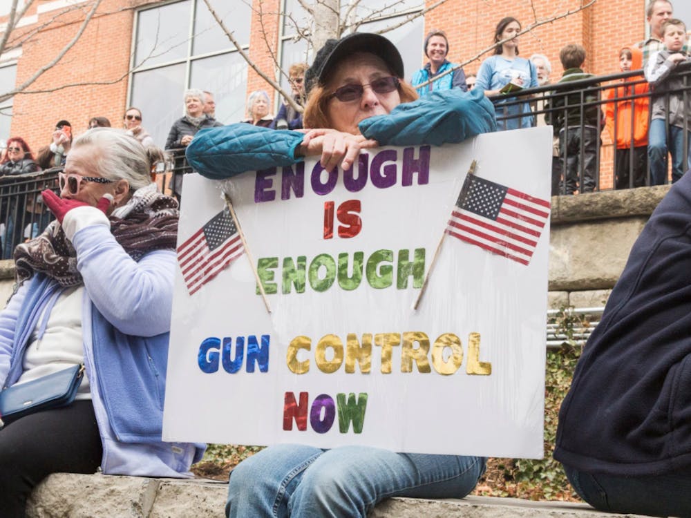 More than a thousand people of all ages gathered at the Sprint Pavilion in Charlottesville before the march around the Downtown Mall, many holding signs against gun violence.