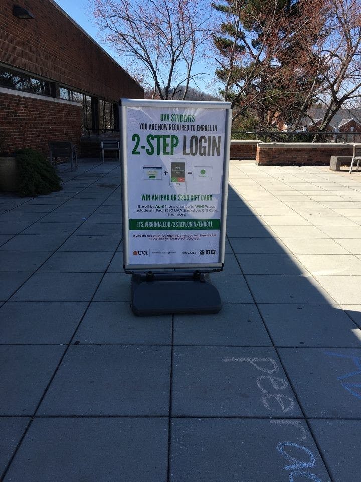 A sign outside Clemons Library with information about the new two-step login
