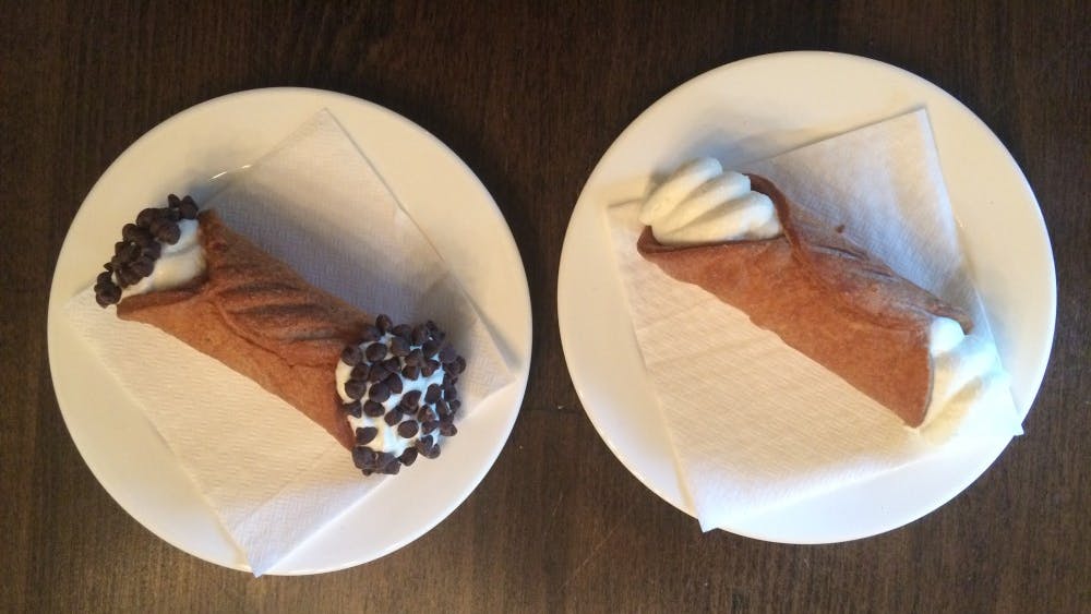 Each cannoli has the same creme filling, which is composed of ricotta cheese, vanilla and a hint of lemon juice. Customers can then choose from four topping options: pistachios, dark chocolate chips, sliced almonds or candied orange peel. 