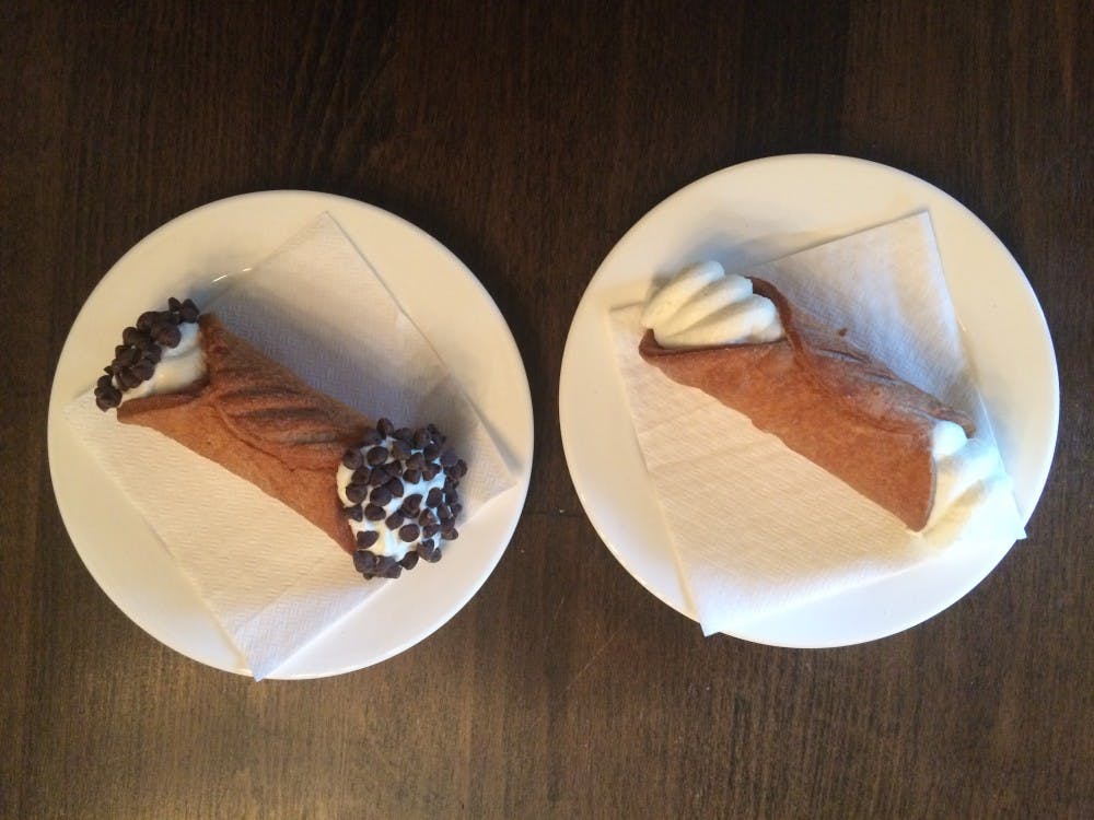 Each cannoli has the same creme filling, which is composed of ricotta cheese, vanilla and a hint of lemon juice. Customers can then choose from four topping options: pistachios, dark chocolate chips, sliced almonds or candied orange peel. 