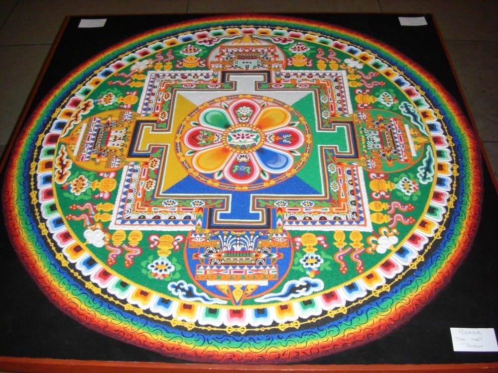 Leena Rose Miller, one of the organizers of the events in Charlottesville, said the community chose the mandala of the Buddha of Compassion for the monks to create.