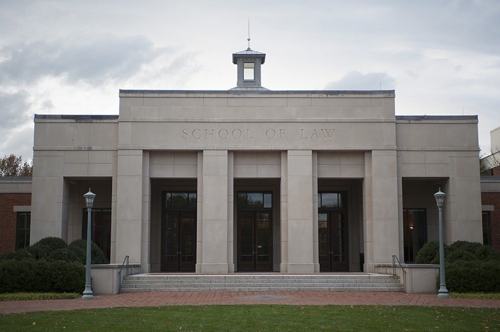 A group of students from the School of Law called on the University Friday to disband the Community-Oriented Policing Squad and instead reinvest in the Charlottesville community.