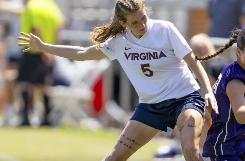 Ryan defends for Virginia against Northwestern.