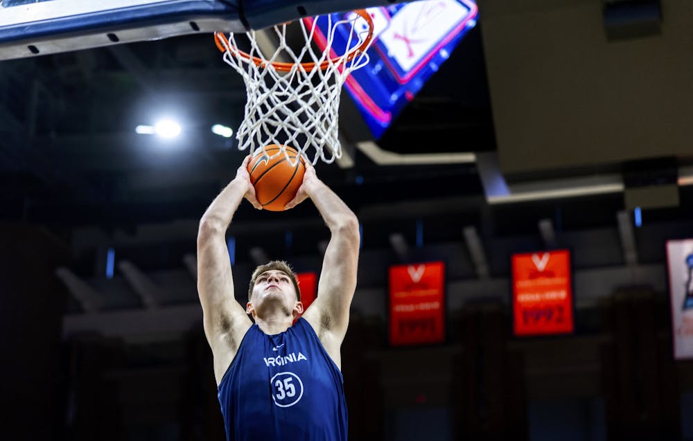 Sophomore forward Carter Lang slams down a dunk at the Pepsi Blue-White Scrimmage.