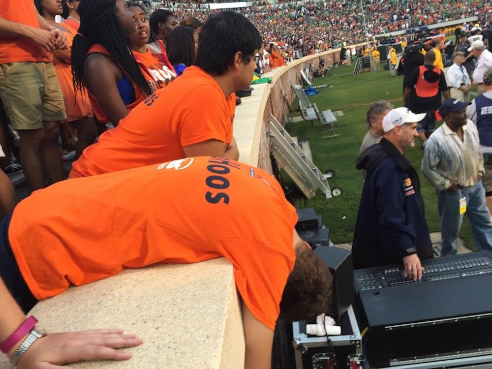 <p>Fourth-year student Mike Bunting reacts to Notre Dame's late touchdown last Saturday at Scott Stadium. </p>