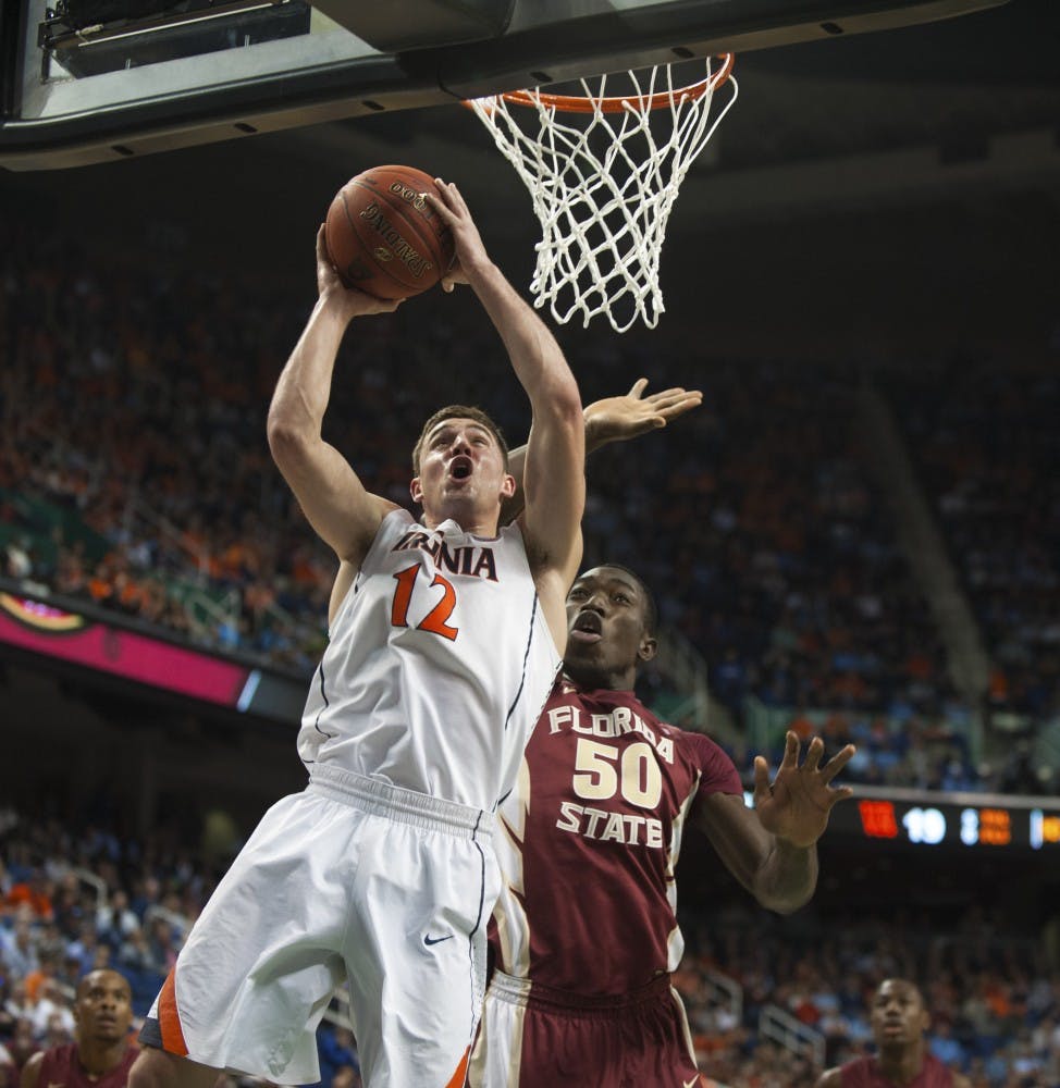	Senior guard Joe Harris goes up for a layup in Virginia&#8217;s quarterfinal win over Florida State