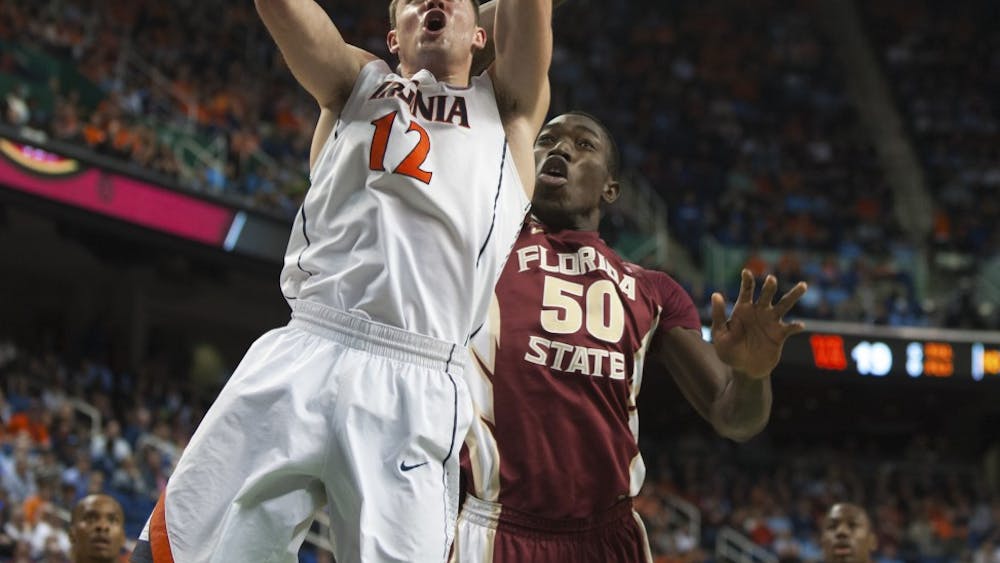 	Senior guard Joe Harris goes up for a layup in Virginia&#8217;s quarterfinal win over Florida State