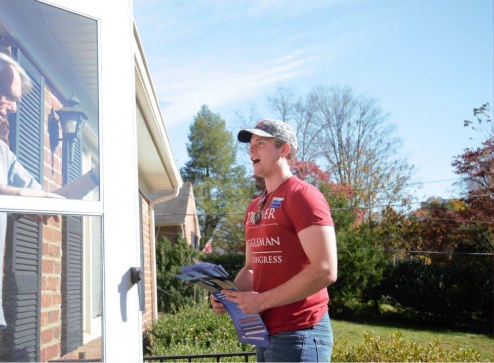 <p>Robert Andrews, a fourth-year College student and chair of the College Republicans, knocks doors Saturday in the Greenbrier neighborhood of Charlottesville.&nbsp;</p>