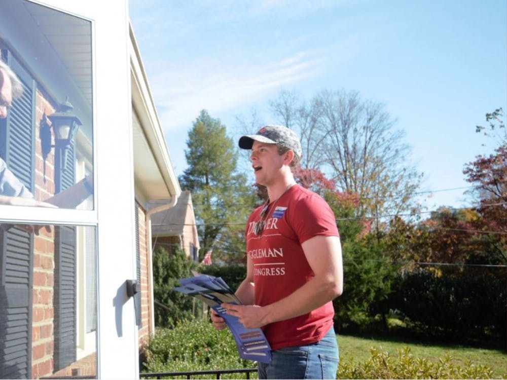 Robert Andrews, a fourth-year College student and chair of the College Republicans, knocks doors Saturday in the Greenbrier neighborhood of Charlottesville.&nbsp;