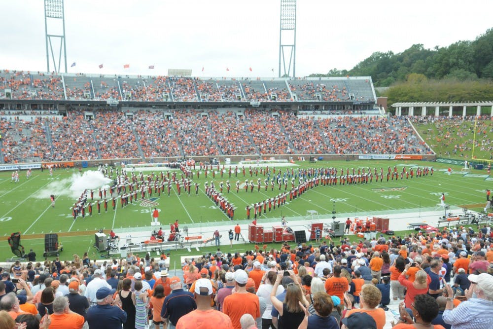 The marching band gets into a plane formation to honor the U.S. Air Force during a halftime performance on Sept. 29.