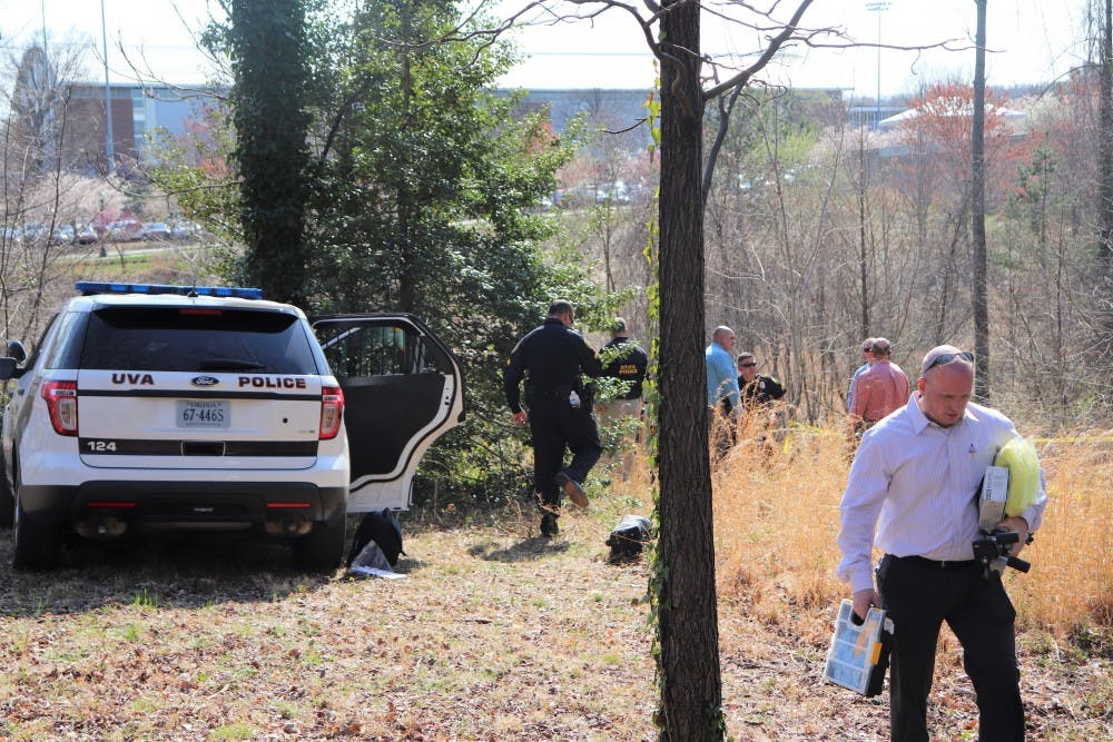 Virginia State Police and University Police Department personnel investigate the scene near John Paul Jones Arena facing Emmet Street.&nbsp;