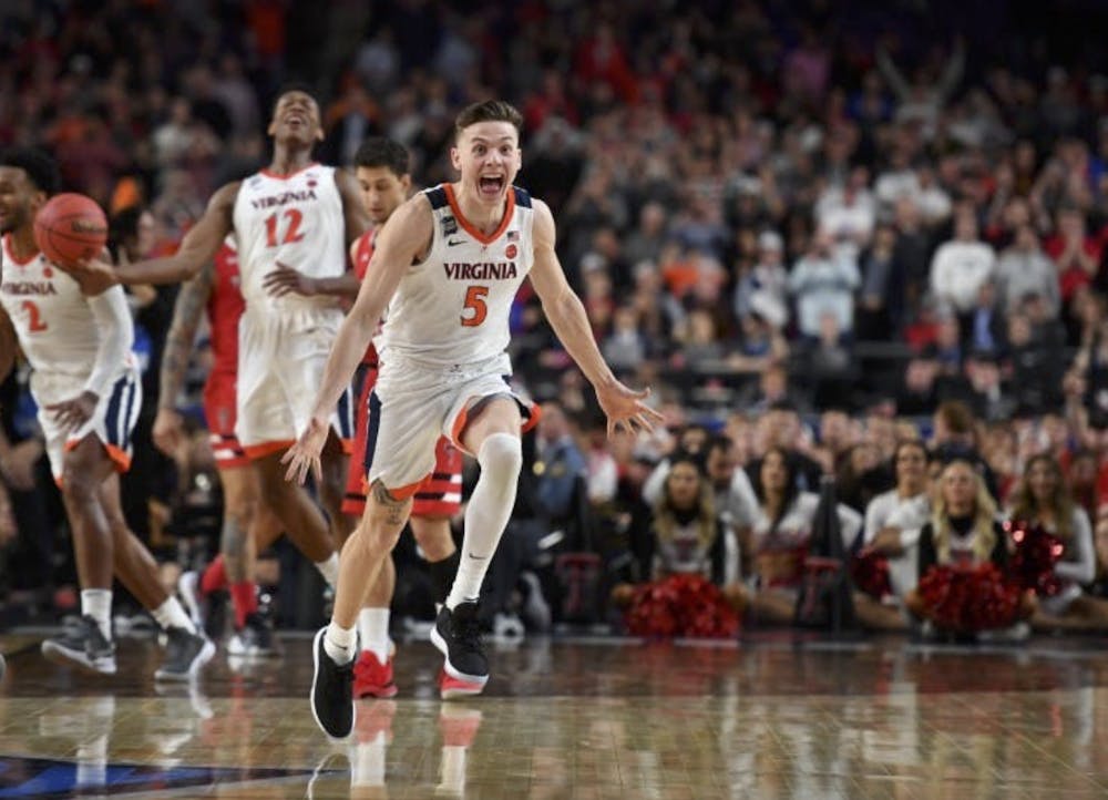 Guy celebrates a Cavaliers victory in the 2019 National Championship.