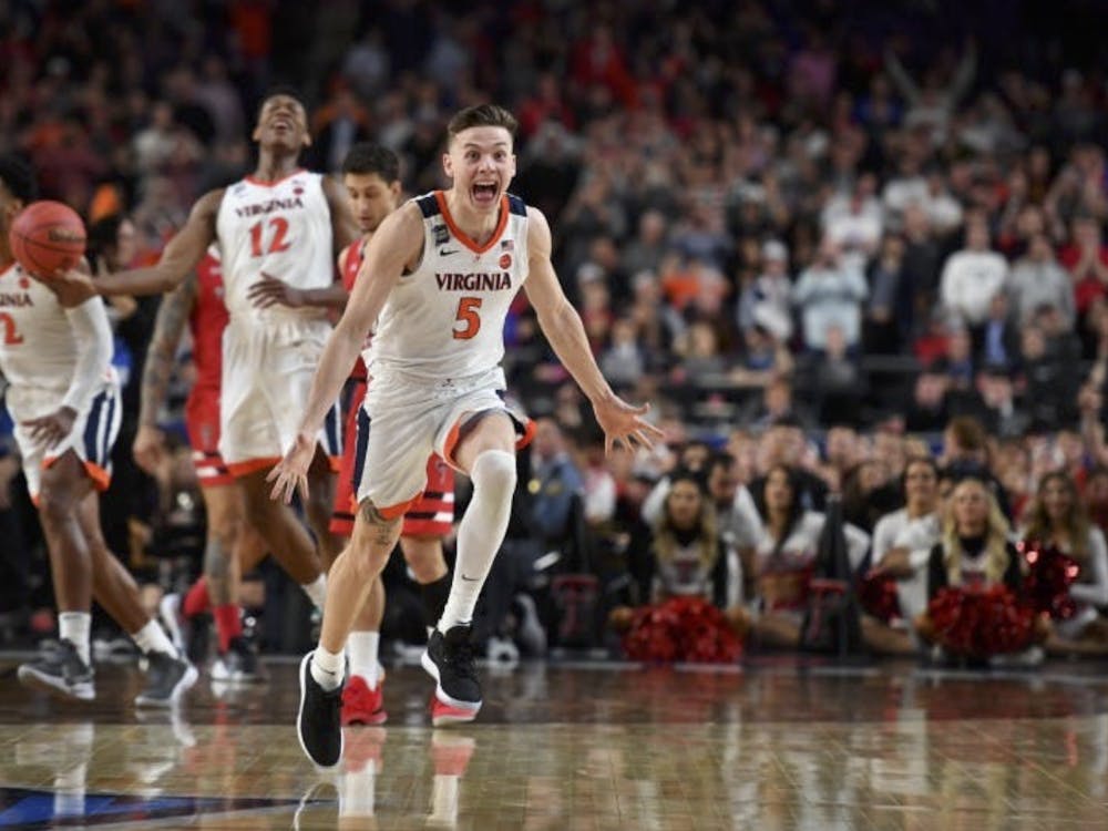 Guy celebrates a Cavaliers victory in the 2019 National Championship.
