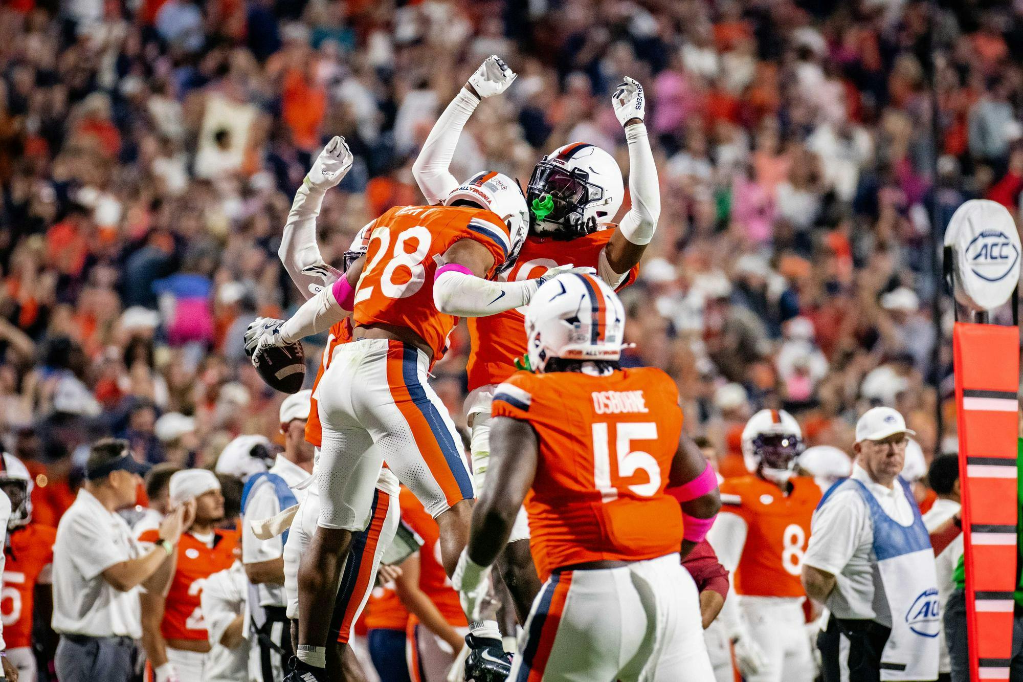 The Cavalier defense celebrates a crucial play.