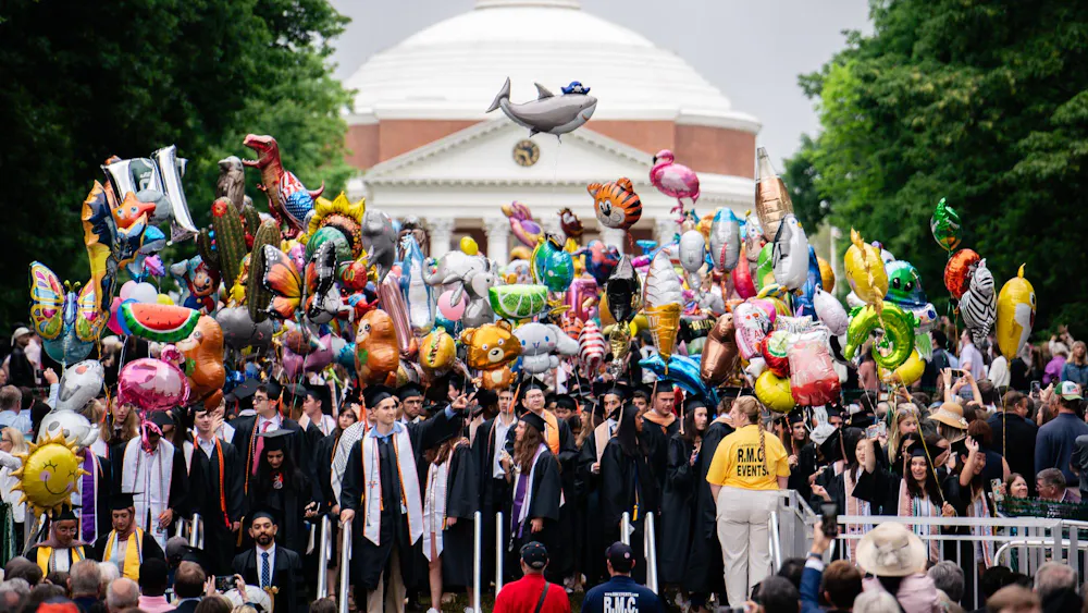 These helium-filled novelties have become a staple at Final Exercises at the University. The tradition began in the past two decades as a way for families to spot graduates in the large, similarly-dressed crowd.