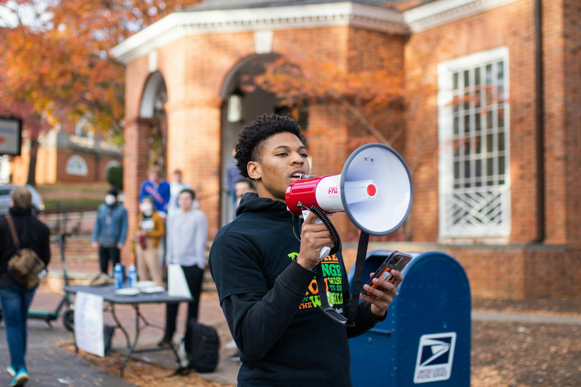 First-year College student Terrell Pittman led chants as the group marched from the Corner to Carr's Hill.&nbsp;