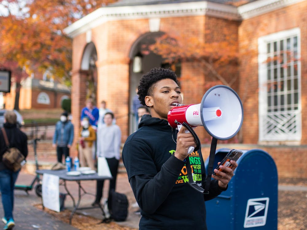 First-year College student Terrell Pittman led chants as the group marched from the Corner to Carr's Hill.&nbsp;