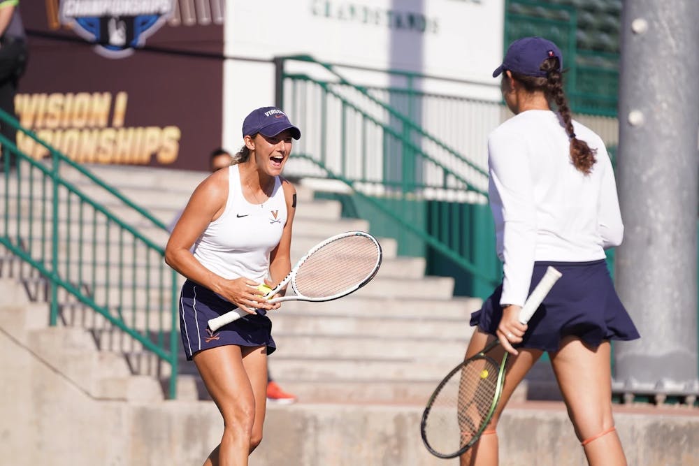 <p>Collard celebrates with Chervinsky after winning a point.</p>