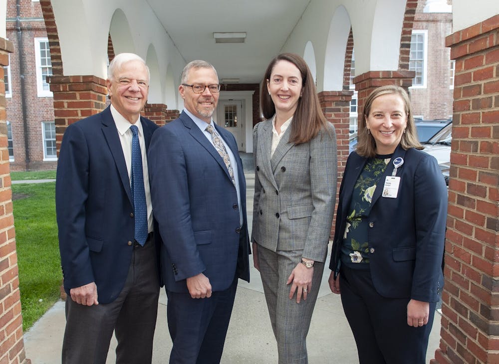 <p>Dr. J. Scott Just (second from left) was appointed Monday as the new chief executive officer of the U.Va. Physicians Group.&nbsp;</p>