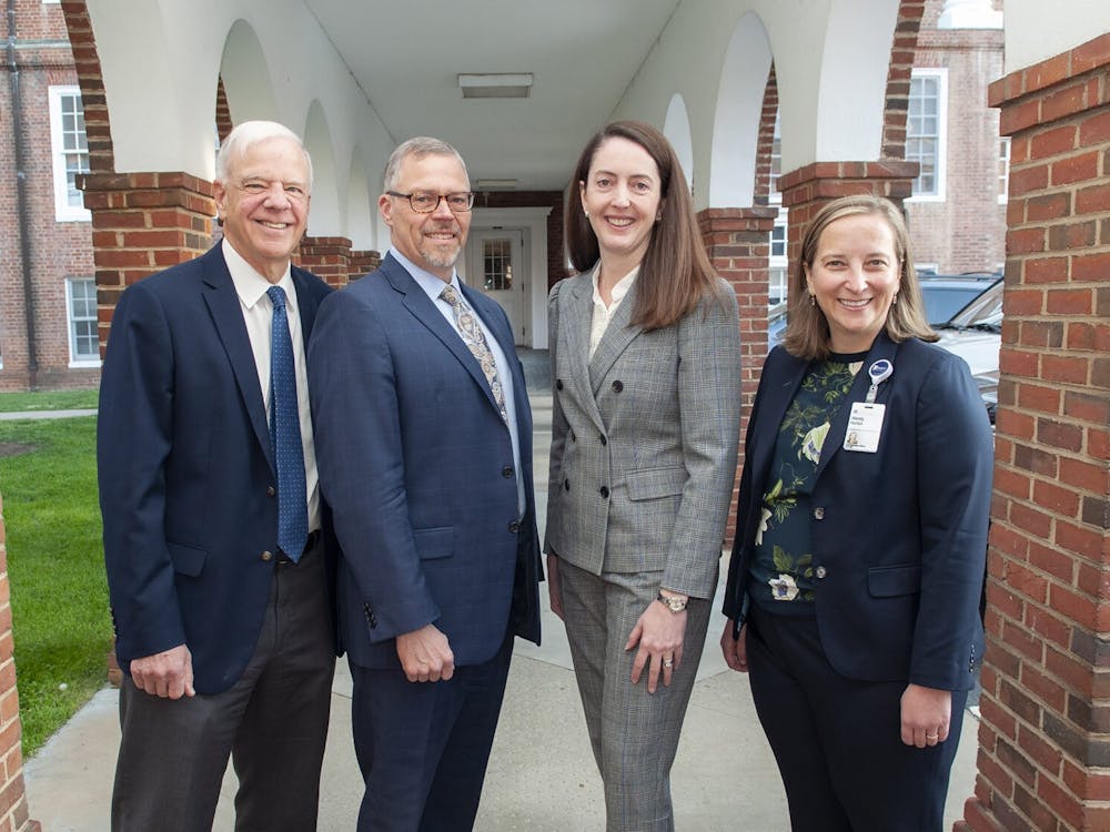 Dr. J. Scott Just (second from left) was appointed Monday as the new chief executive officer of the U.Va. Physicians Group.&nbsp;