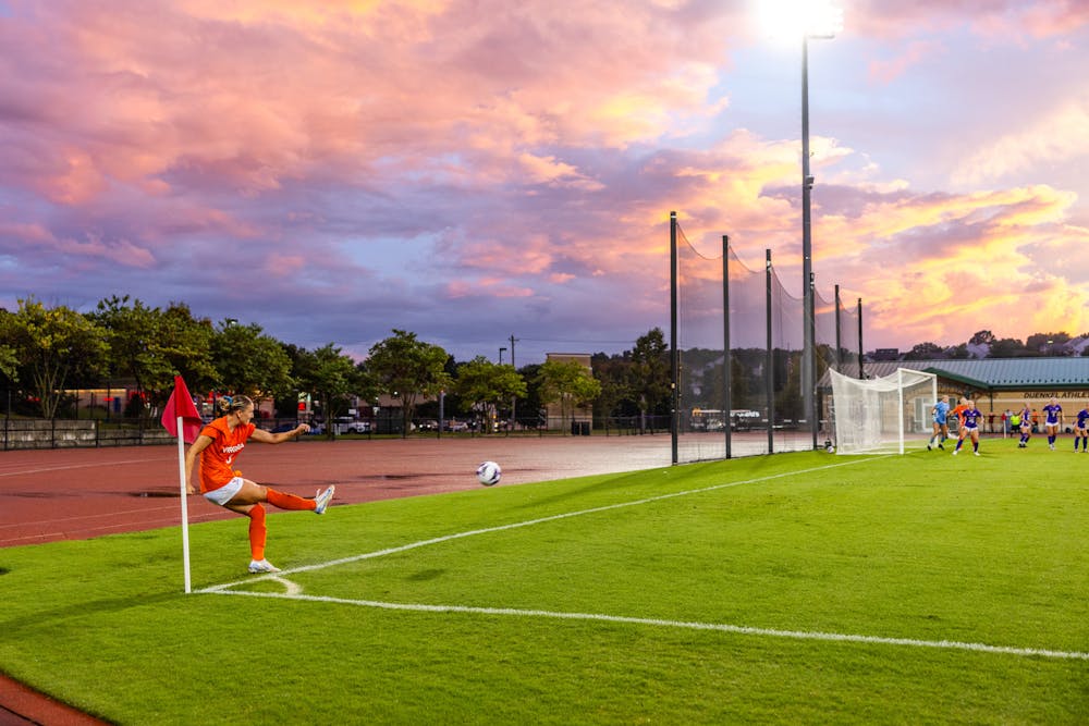 <p>Graduate midfielder Alexis Theoret sends a corner kick into the box Sunday against James Madison.</p>