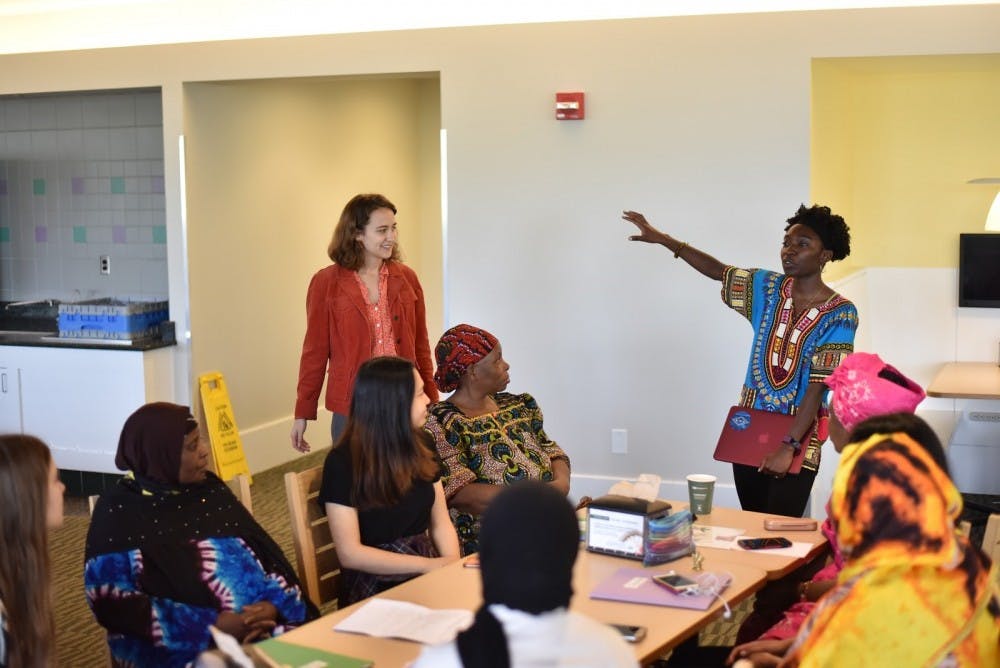Elma Adusei and Elise Petersen-McMath graduated from the University last May. Here they are speaking with a group of English Language Learners.