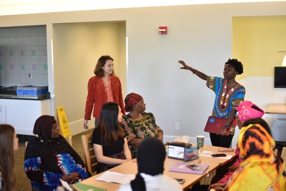 <p>Elma Adusei and Elise Petersen-McMath graduated from the University last May. Here they are speaking with a group of English Language Learners.</p>
