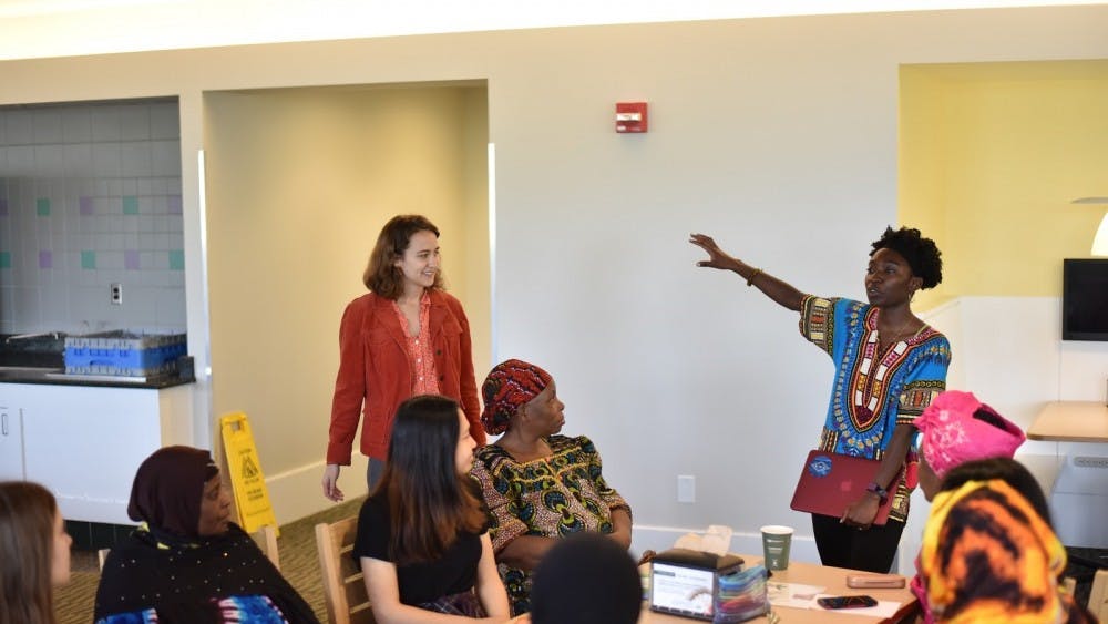 Elma Adusei and Elise Petersen-McMath graduated from the University last May. Here they are speaking with a group of English Language Learners.