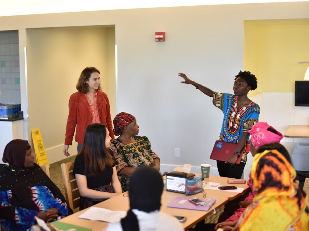 Elma Adusei and Elise Petersen-McMath graduated from the University last May. Here they are speaking with a group of English Language Learners.