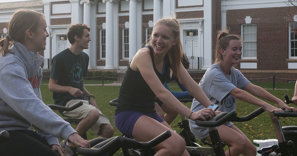 Building Tomorrow's Bike to Uganda fundraiser asked students to donate money and bike for 30-minute intervals on stationary bikes to raise funds for building schools.