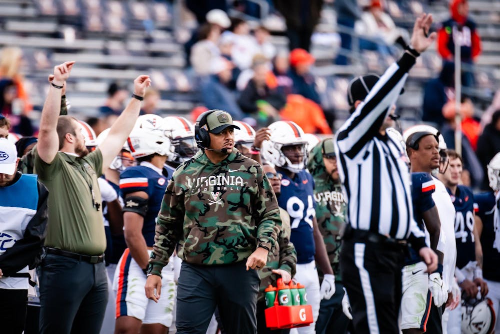 Coach Tony Elliott surveys the field against Southern Methodist Nov 23.